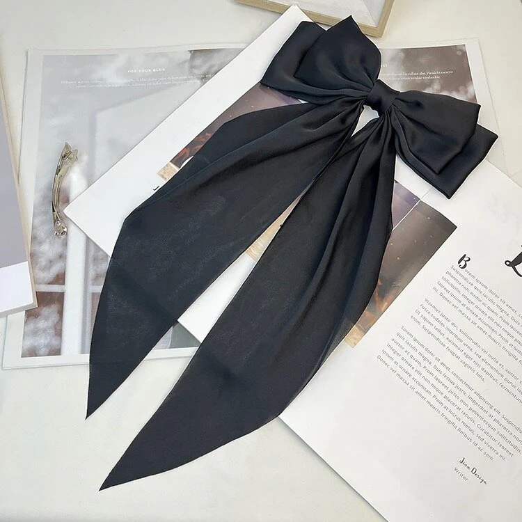 Zacharia | Grote zwarte satijnen strik met linten op een haarklip