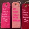 Afbeelding van Sleutelhanger Eat Sleep Swim Repeat Roze