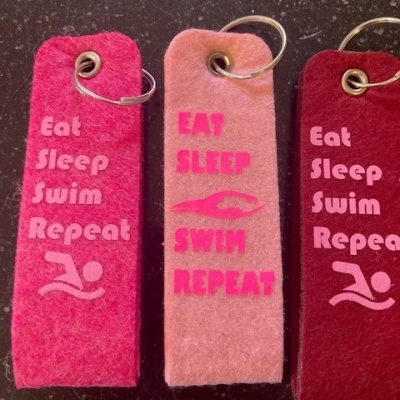 Foto van Sleutelhanger Eat Sleep Swim Repeat Roze